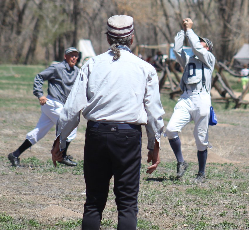 “Cannibal” is the Blue Stockings manager and first baseman. Here, he makes a bare-handed grab of a pop fly.